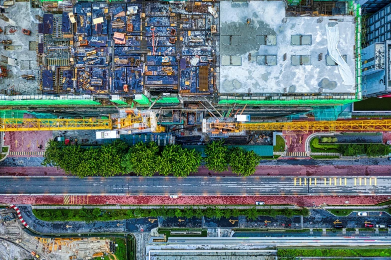 an aerial view of a construction site in a city, an album cover, pexels contest winner, kowloon, tone mapping, thumbnail, multi - coloured