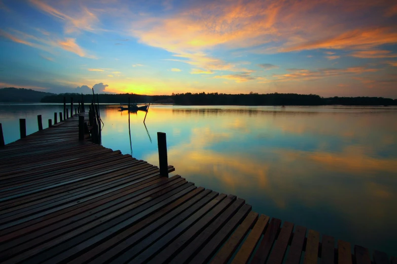a dock that is next to a body of water, pexels contest winner, hurufiyya, sunset colors, lagoon, close scene