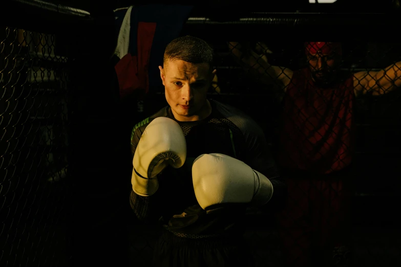 a close up of a person wearing boxing gloves, profile image, combat scene, zachary corzine, lachlan bailey
