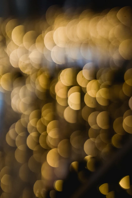 a close up of a street light with a blurry background, by Jan Rustem, lyrical abstraction, golden orbs, dots abstract, soft light - n 9, bubbly