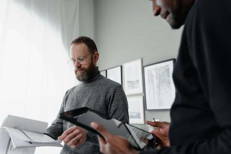 a couple of men standing next to each other, by Jesper Knudsen, writing on a clipboard, grey, healthcare, thumbnail