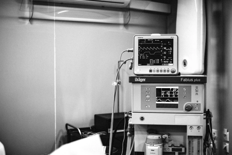 a black and white photo of a hospital room, a black and white photo, by Daniel Lieske, pexels, happening, oscilloscope, background image, colorful medical equipment, 1 9 9 8 photo