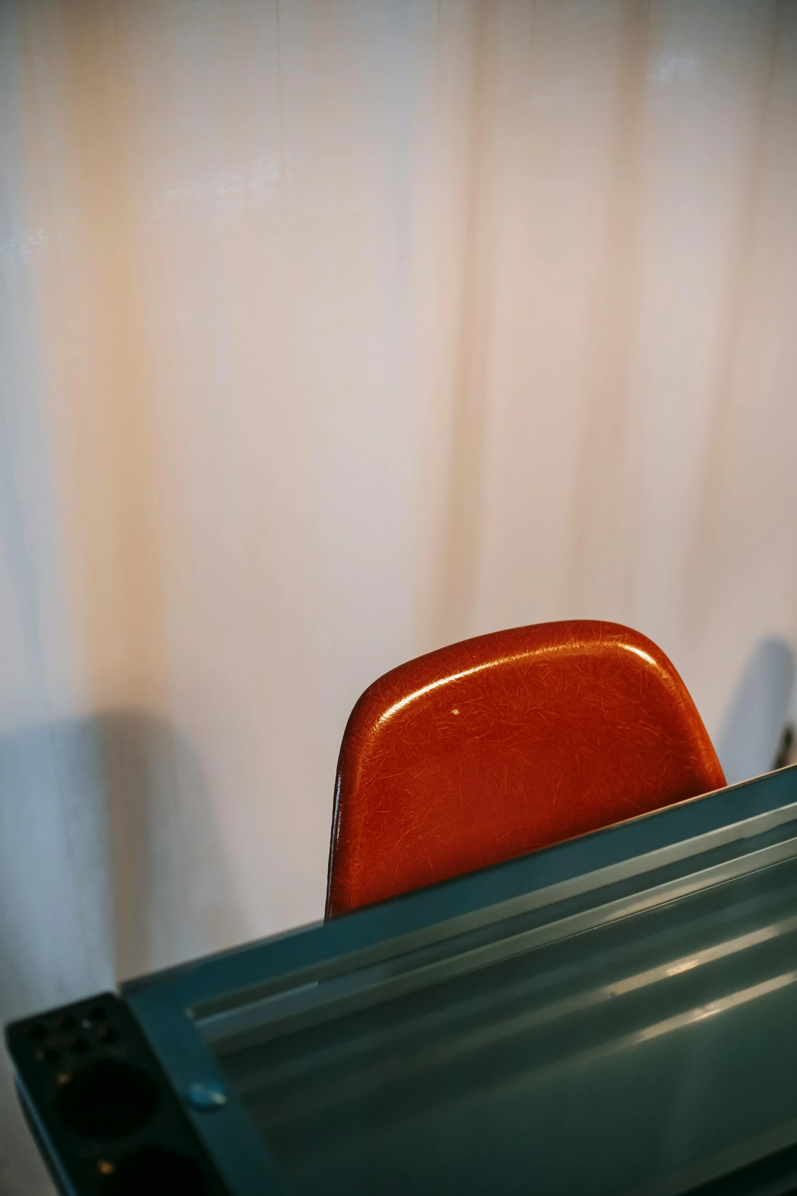 a close up of a table with a red chair, unsplash, pareidolia, panel, brown, student