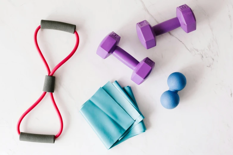 a pair of purple dumbbells sitting next to a pair of blue dumbbells, by Helen Stevenson, pexels contest winner, private press, background image, harnesses, various items, 6 pack ab