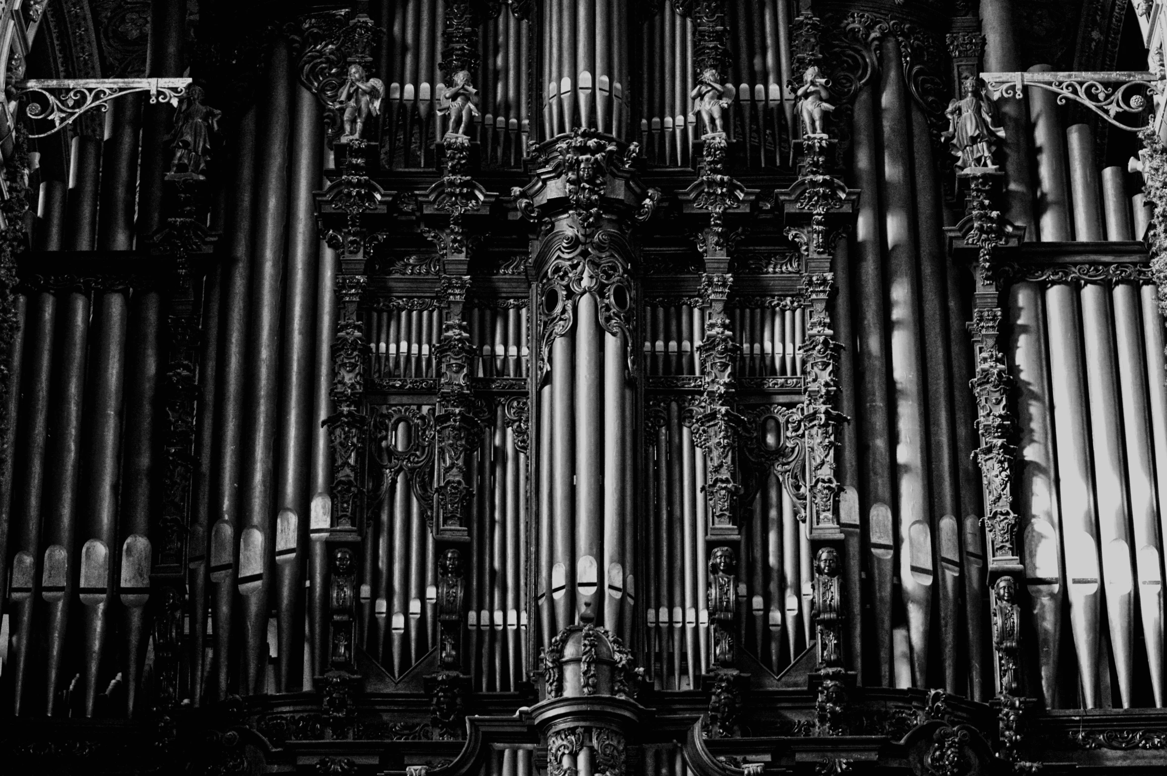 a black and white photo of a pipe organ, inspired by Bryan Organ, pexels contest winner, baroque, highly detailed and complex, unsplash photo contest winner, diablo, vertical