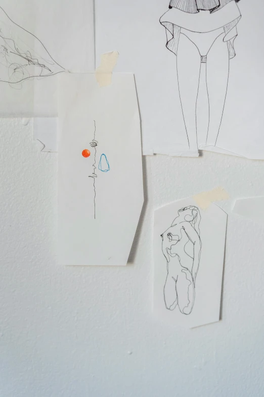 a refrigerator with a bunch of drawings on it, an abstract drawing, conceptual art, ultrafine detail, with small object details, female forms, white wall