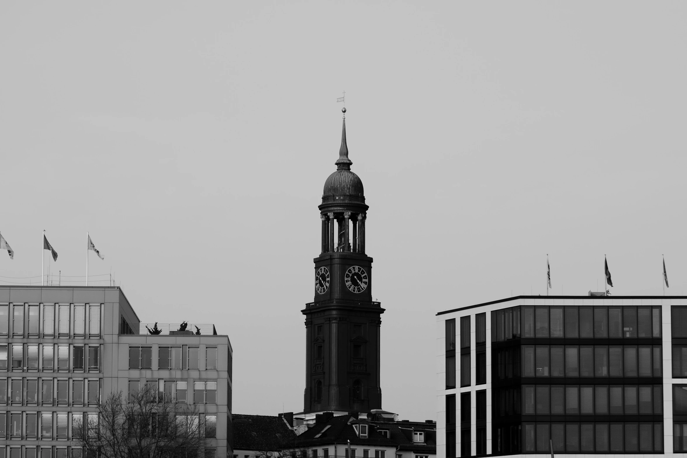 a black and white photo of a clock tower, a black and white photo, pexels, berlin secession, an abandoned old, lead - covered spire, day cityscape, modern high sharpness photo