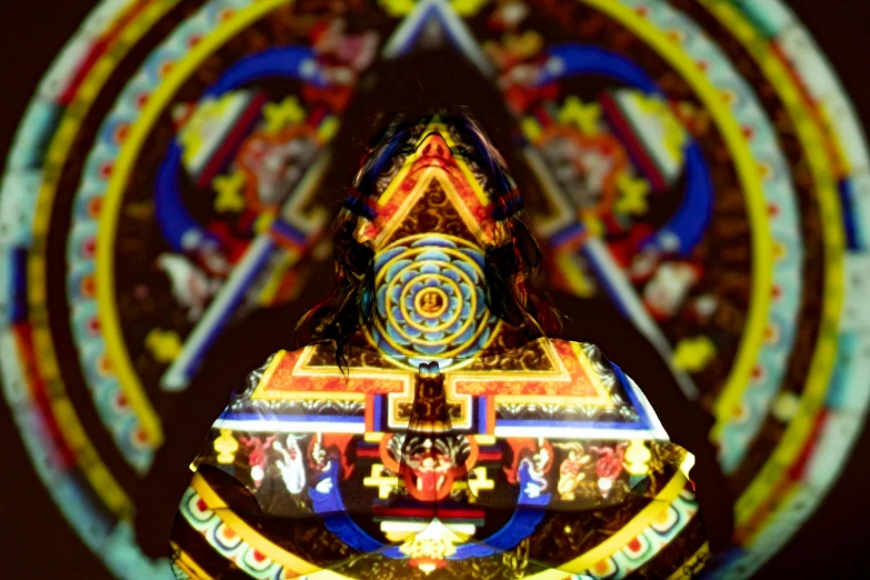 a close up of a statue in front of a stained glass window, by Jon Coffelt, cloisonnism, giant aztec spaceship, symmetrical image, tibet, highly detailed zen neon