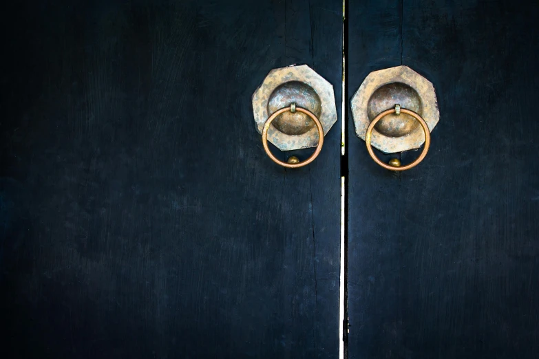 a pair of shoes sitting on top of a wooden door, inspired by Gertrude Abercrombie, unsplash, metal handles, square, blue black gold, traditional chinese