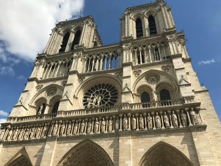 a very tall cathedral with a clock on it's side, a photo, unsplash, romanesque, elaborate carved wood balconies, on loan from louvre, high details photo, square