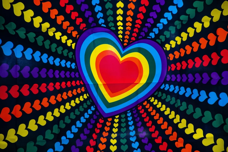 a rainbow colored heart on a black background, inspired by Lisa Frank, psychedelic art, 1970s vintage art, v tuber, angus mckie, backdrop