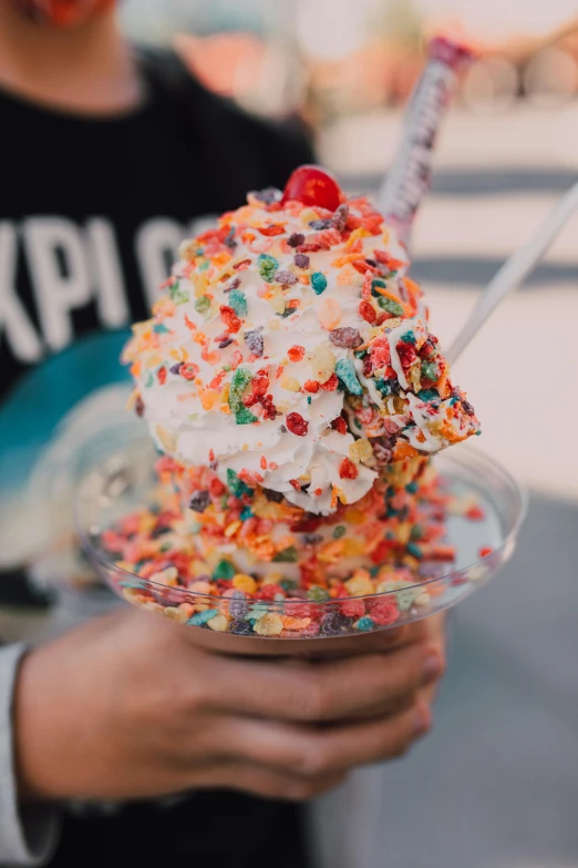 a close up of a person holding a plate with an ice cream sundae, a colorized photo, by Robbie Trevino, trending on unsplash, covered in sprinkles, 🐿🍸🍋, toki doki, flowy