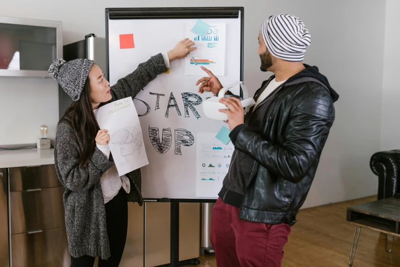 a couple of people standing in front of a white board, a cartoon, trending on unsplash, ai startup, background image, flatlay, start