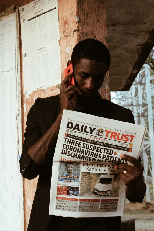 a man reading a newspaper while talking on a cell phone, an album cover, by Dean Ellis, pexels contest winner, david uzochukwu, trustworthy, looking defiantly at the camera, instagram photo