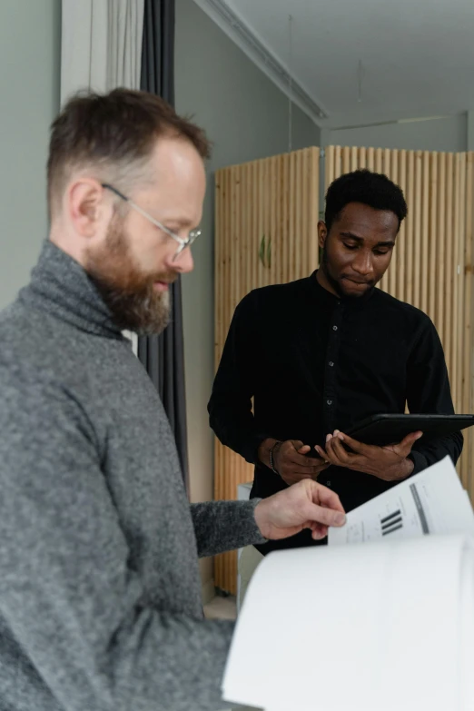 a couple of men standing next to each other, pexels contest winner, private press, writing on a clipboard, plotter, ignant, mit technology review