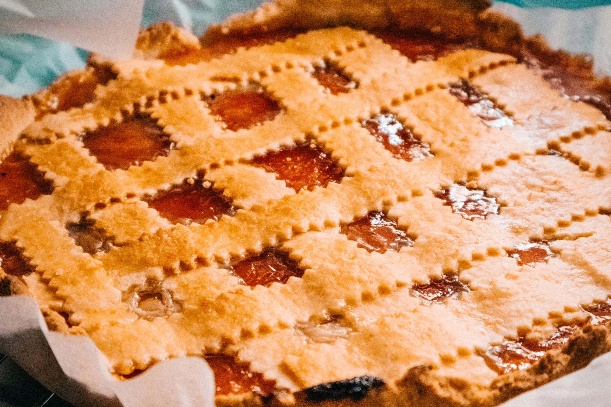 a close up of a pie on a table, pexels contest winner, jelly - like texture, peach and goma style, corduroy, lattice