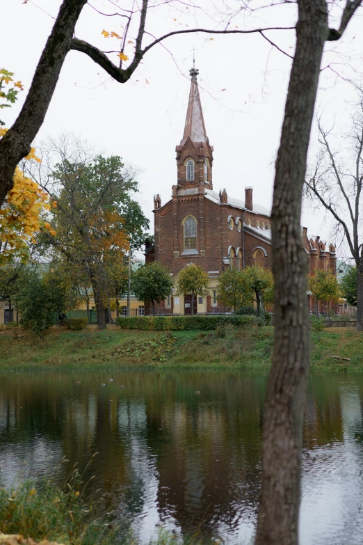 a body of water with a church in the background, park, il, old town, october