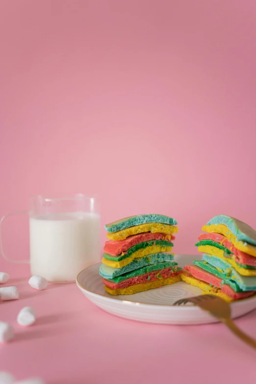 a plate of colorful cookies next to a glass of milk, by Julia Pishtar, color field, marshmallow graham cracker, layers on layers on layers, sandwich, made of cotton candy