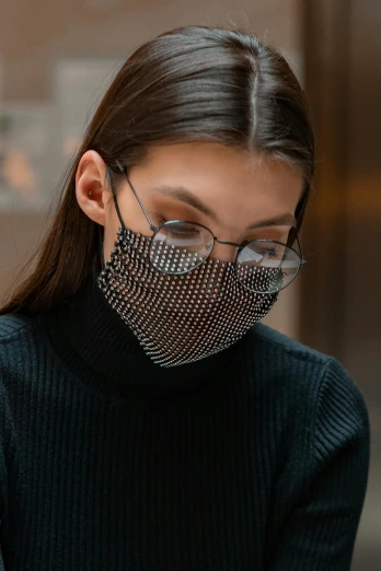 a woman wearing a face mask using a cell phone, by Nina Hamnett, chainmail, wear ray - ban glass, black, made of crystal