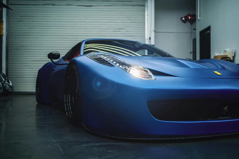 a blue sports car parked in a garage, inspired by An Gyeon, pexels contest winner, photorealism, ferrari 458, soft light 4k, instagram picture, race car