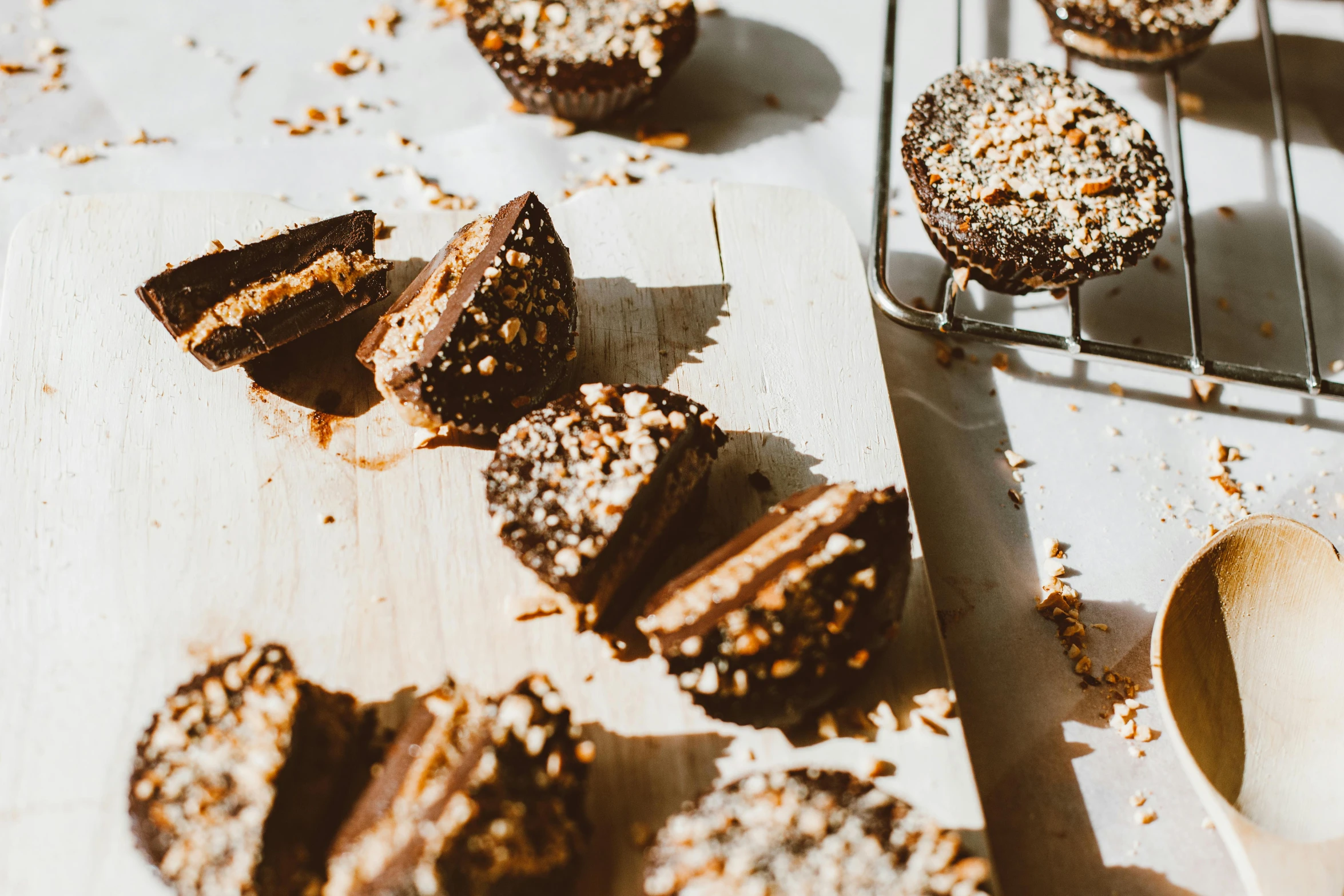 a bunch of cookies that are on a table, a photo, by Emma Andijewska, unsplash, rocky roads, caramel, coconuts, cut-away