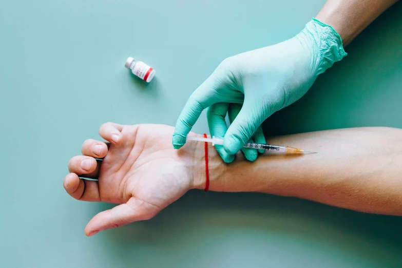 a close up of a person's hand with a needle, trending on pexels, hurufiyya, syringe, 🦩🪐🐞👩🏻🦳, full length shot, epicanthal fold