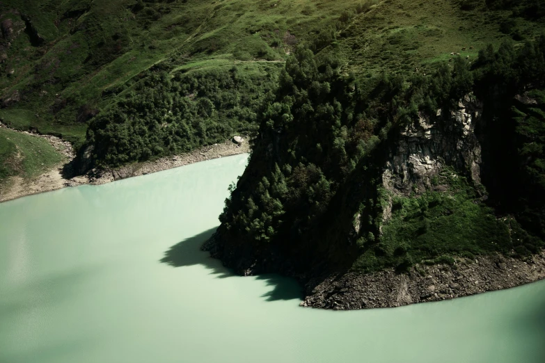 a large body of water with a mountain in the background, inspired by Elsa Bleda, hurufiyya, alessio albi, 1960s color photograph, new zealand, photogrammetry