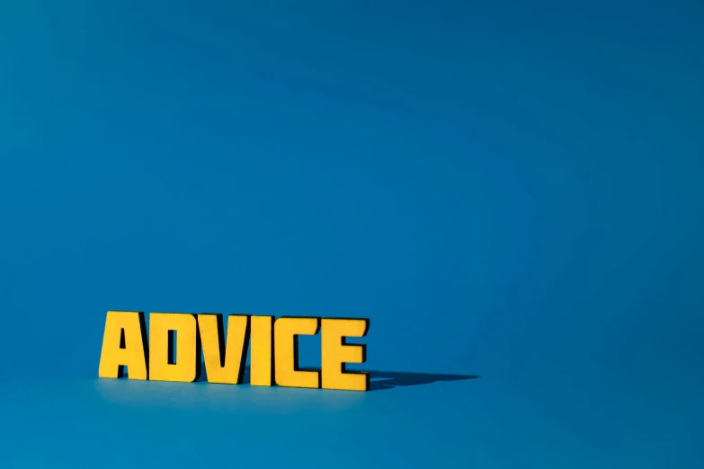 a sign that says advice against a blue background, by Dave Allsop, yellow, shot on sony a 7, 3d minimalistic, magazine photo