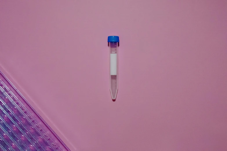 a pen sitting on top of a pink surface, by Pamphilus, plasticien, dna experiment, minimalistic aesthetics, detailed product image, front