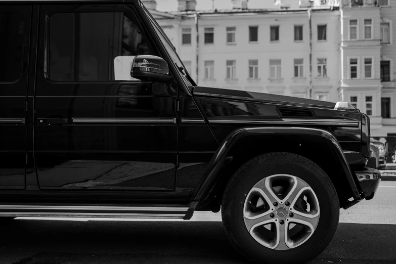 a black suv parked on the side of the road, pexels contest winner, renaissance, square, black lacquer, black an white, low detailed