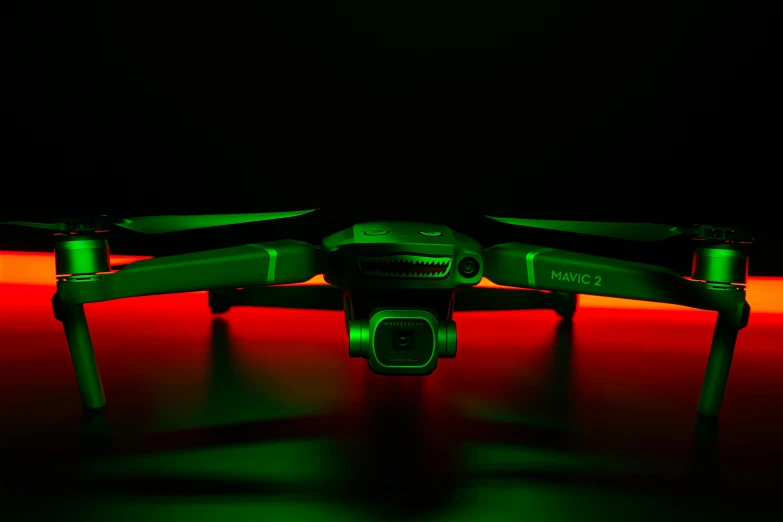 a green drone sitting on top of a red surface, by Adam Marczyński, pexels contest winner, holography, night time low light, toy photo, cinematic shot ar 9:16 -n 6 -g, wings made of light