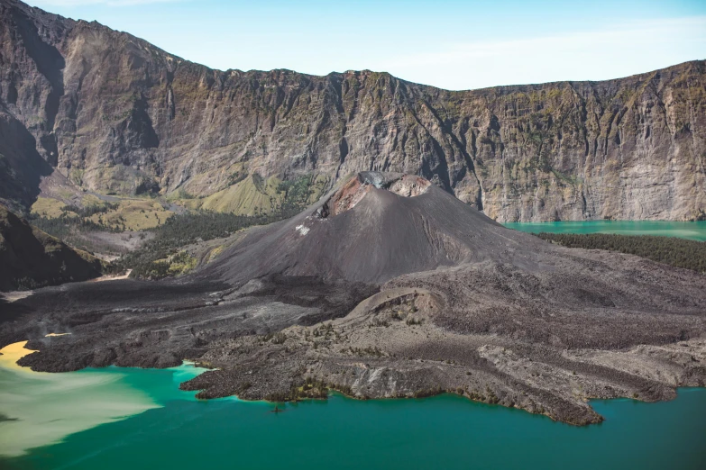 a mountain with a lake in the middle of it, pexels contest winner, sumatraism, white lava, blue and green water, ash thorp, found on a volcano