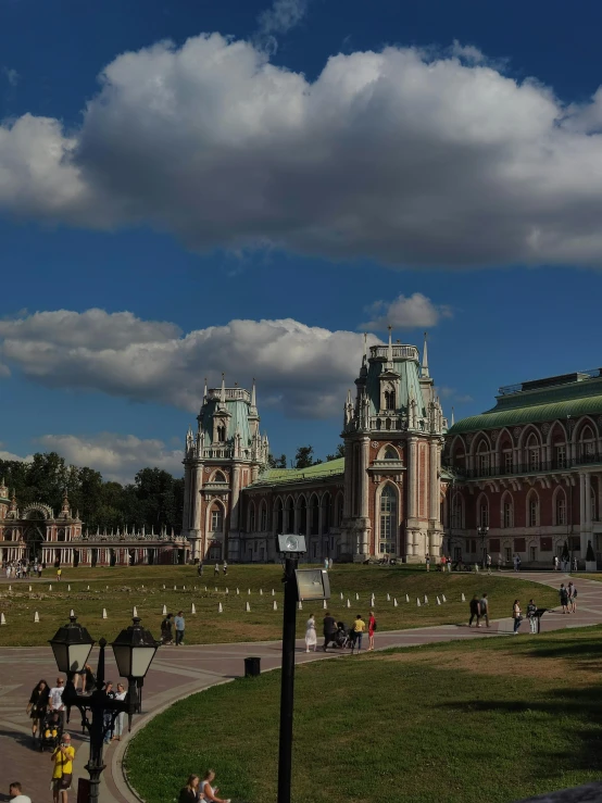 a large building sitting on top of a lush green field, inspired by Konstantin Vasilyev, pexels contest winner, rococo, panoramic, 000 — википедия, red square, royal palace interior