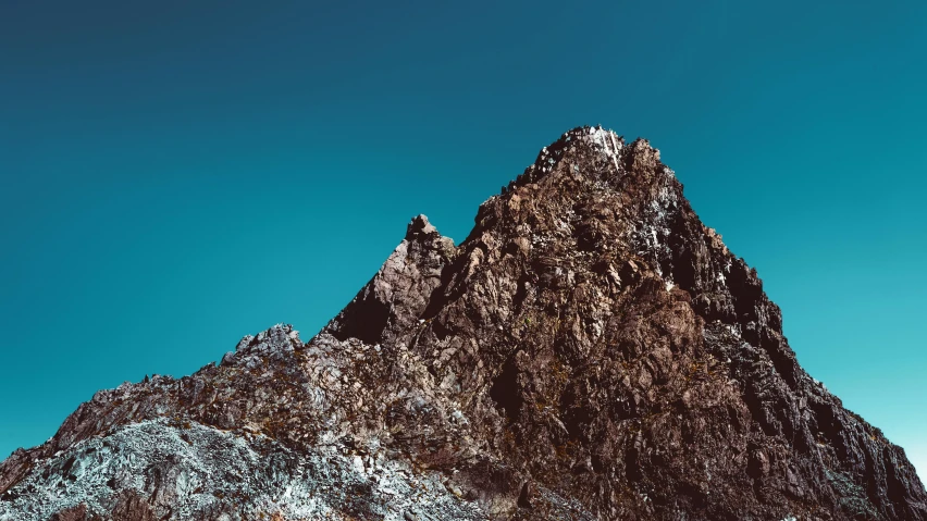 a group of people standing on top of a mountain, an album cover, unsplash, minimalism, brown and cyan color scheme, crystalized, spire, quixel megascans