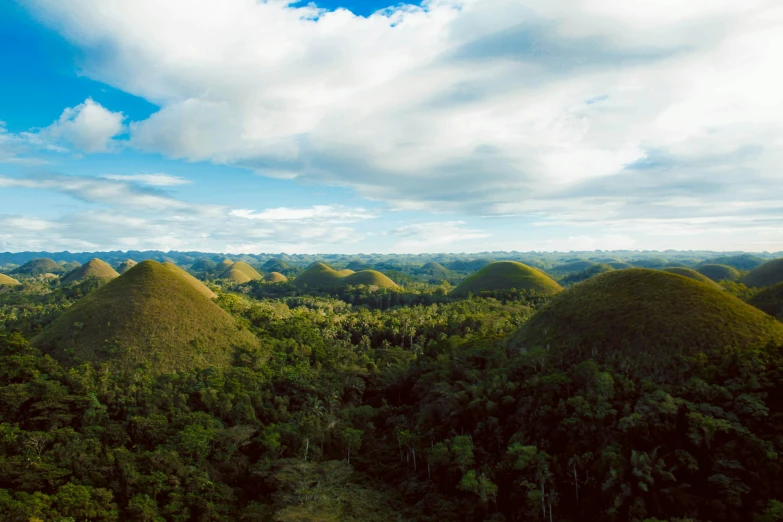 the chocolate hills in boholi, boholi island, boholi island, boholi island, boholi island,, pexels contest winner, wide aerial shot, amanda lilleston, ultrawide lens”, andes mountain forest