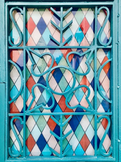 a close up of a window on a building, inspired by Gaudi, trending on unsplash, art nouveau, south beach colors, moroccan mosque, outside the'school of magic ', squares