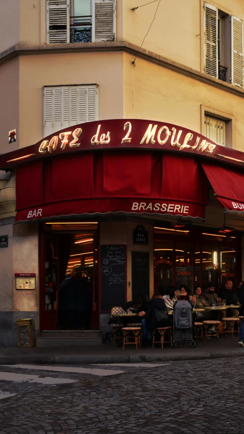 a restaurant with a red awning on a cobblestone street, inspired by Théophile Steinlen, pexels, art nouveau, square, two, morning, louis dupre