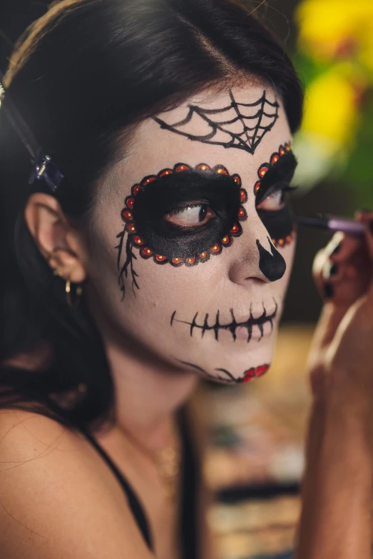 a woman is getting her make up done, an airbrush painting, pexels contest winner, lowbrow, sugar skull, profile image, square, fancy dress