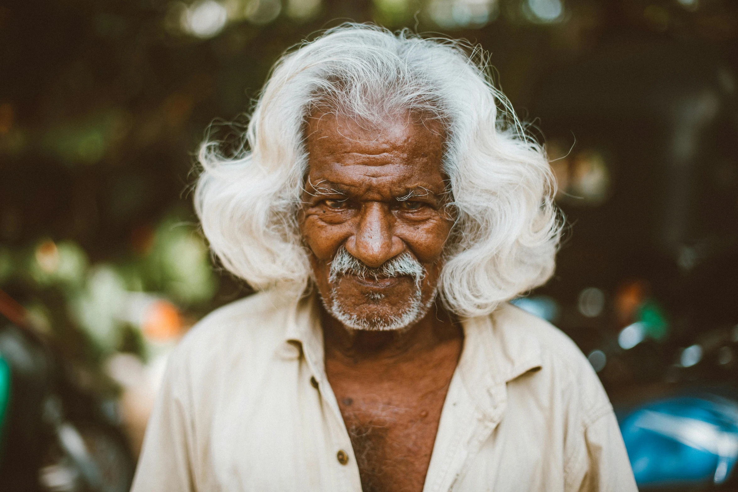 a man with white hair and a moustache on his face, pexels contest winner, indian girl with brown skin, old male, east african man with curly hair, very old