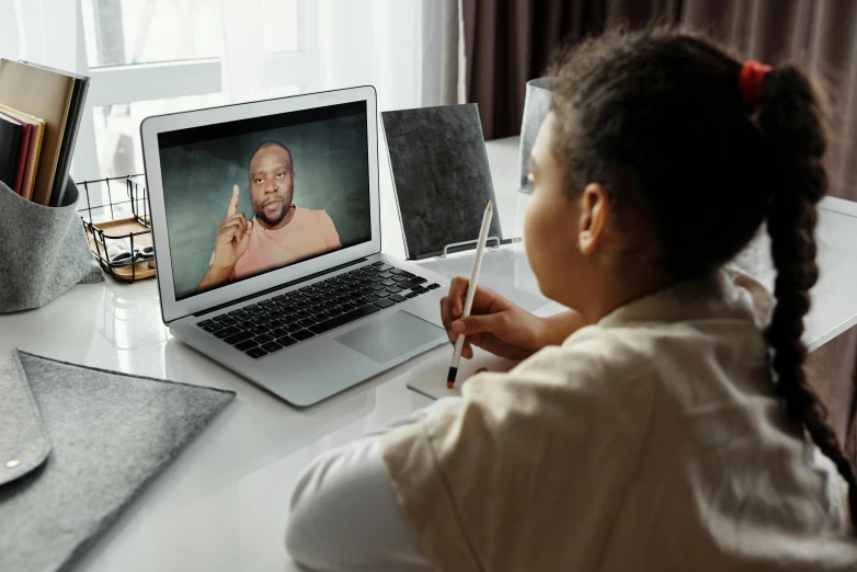 a little girl sitting in front of a laptop computer, pexels, video art, photo of a black woman, teaching, photo of a man, full faced