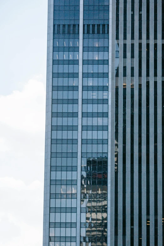 a couple of tall buildings sitting next to each other, an album cover, inspired by Andreas Gursky, unsplash, downtown jacksonville florida, telephoto long distance shot, glass windows, 1999 photograph