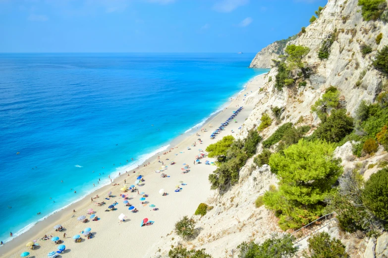 a beach filled with lots of people and umbrellas, pexels contest winner, renaissance, chalk cliffs above, greek nose, avatar image, thumbnail