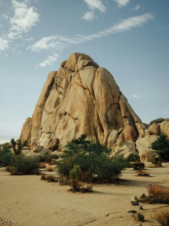 a large rock formation in the middle of a desert, granite, paul barson, conde nast traveler photo, postprocessed