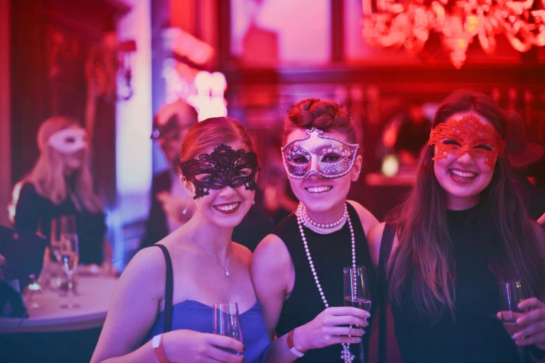 a group of women standing next to each other at a party, pexels contest winner, art nouveau, masquerade mask, red glow, themed after wine, 2 5 6 x 2 5 6 pixels