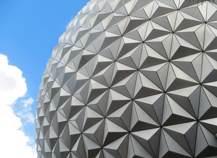 a close up of a building with a sky background, inspired by Buckminster Fuller, pexels contest winner, disney world, grey mouse ears, epcot, “diamonds