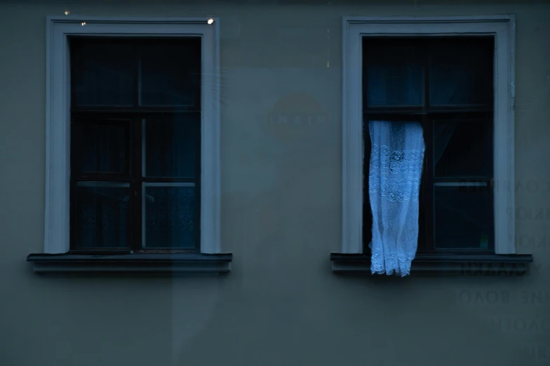 a fire hydrant sitting in front of two windows, an album cover, inspired by Elsa Bleda, pexels contest winner, winter blue drapery, zoran janjetov, halloween ghost under a sheet, spying