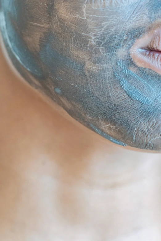 a close up of a person with a face mask, by Arabella Rankin, reddit, titanium buff, bottom body close up, blue gray, spa