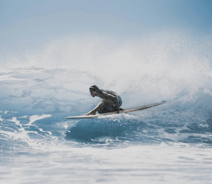 a man riding a wave on top of a surfboard, unsplash contest winner, manuka, skiing, bending down slightly, heath clifford