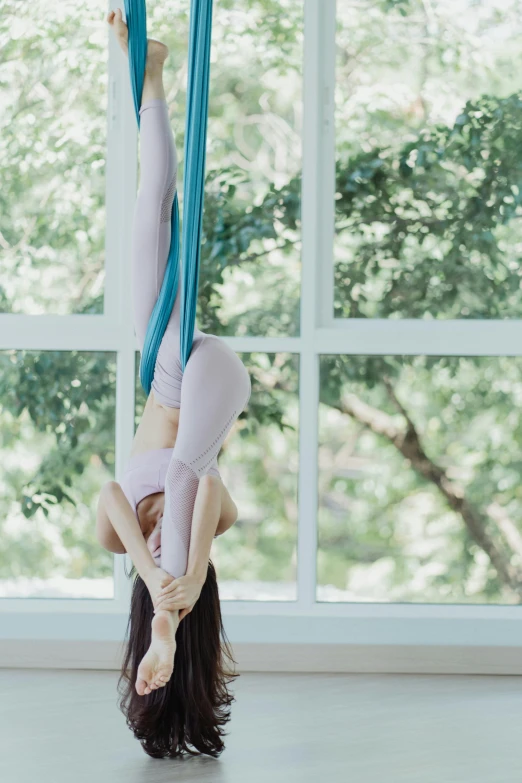 a woman doing aerial yoga in front of a window, a picture, pexels contest winner, arabesque, pastels, mai anh tran, instagram story, profile image