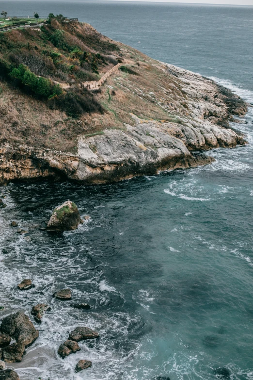 a large body of water next to a rocky shore, pexels contest winner, down there, 2 5 6 x 2 5 6 pixels, in spain, slide show